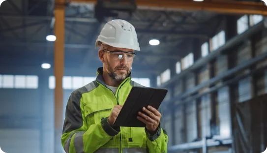 Manufacturing worker with tablet