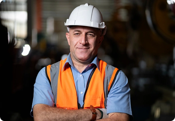 Manufacturing worker in hardhat and safety vest